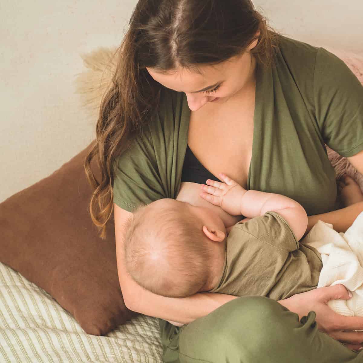 the concept of breastfeeding. portrait of mom and breastfeeding baby